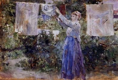 a woman hanging laundry