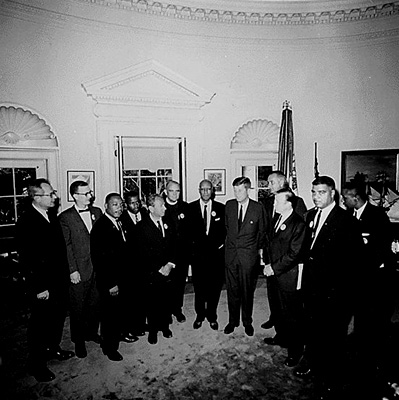 a photograph of President Kennedy meeting Martin Luther King Jr. and other prominent civil rights leaders